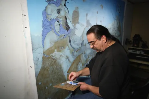 A man painting a mural