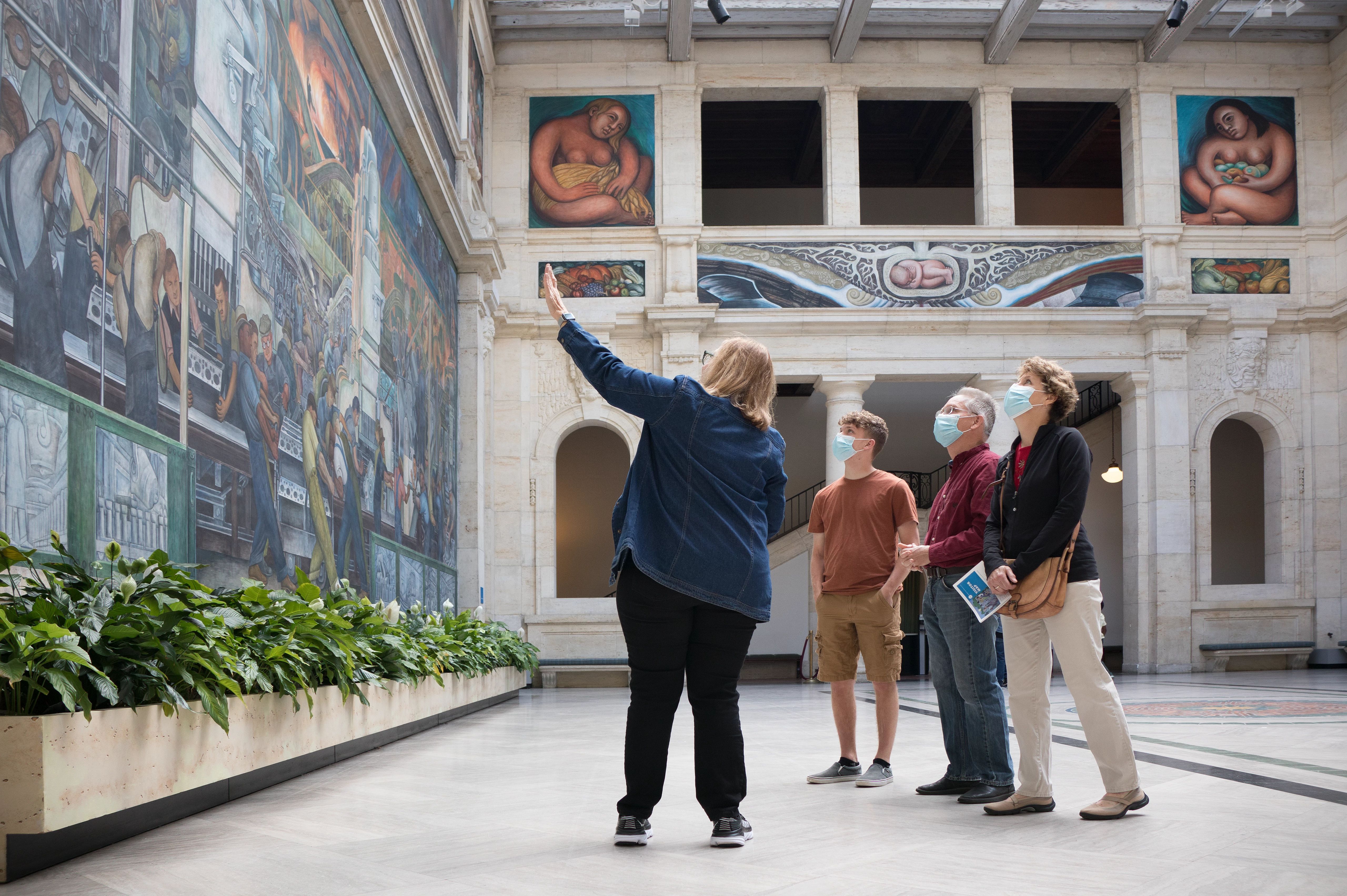 A DIA Volunteer talks about Rivera Court to a small group of museum visitors. 