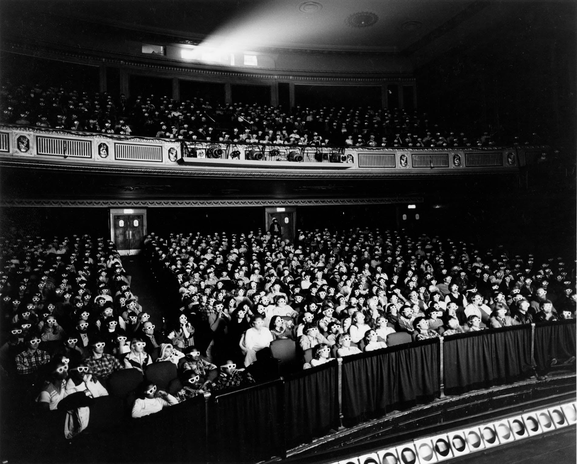 Black and white historical photograph of the audience in the Detroit Film Theatre Auditorium
