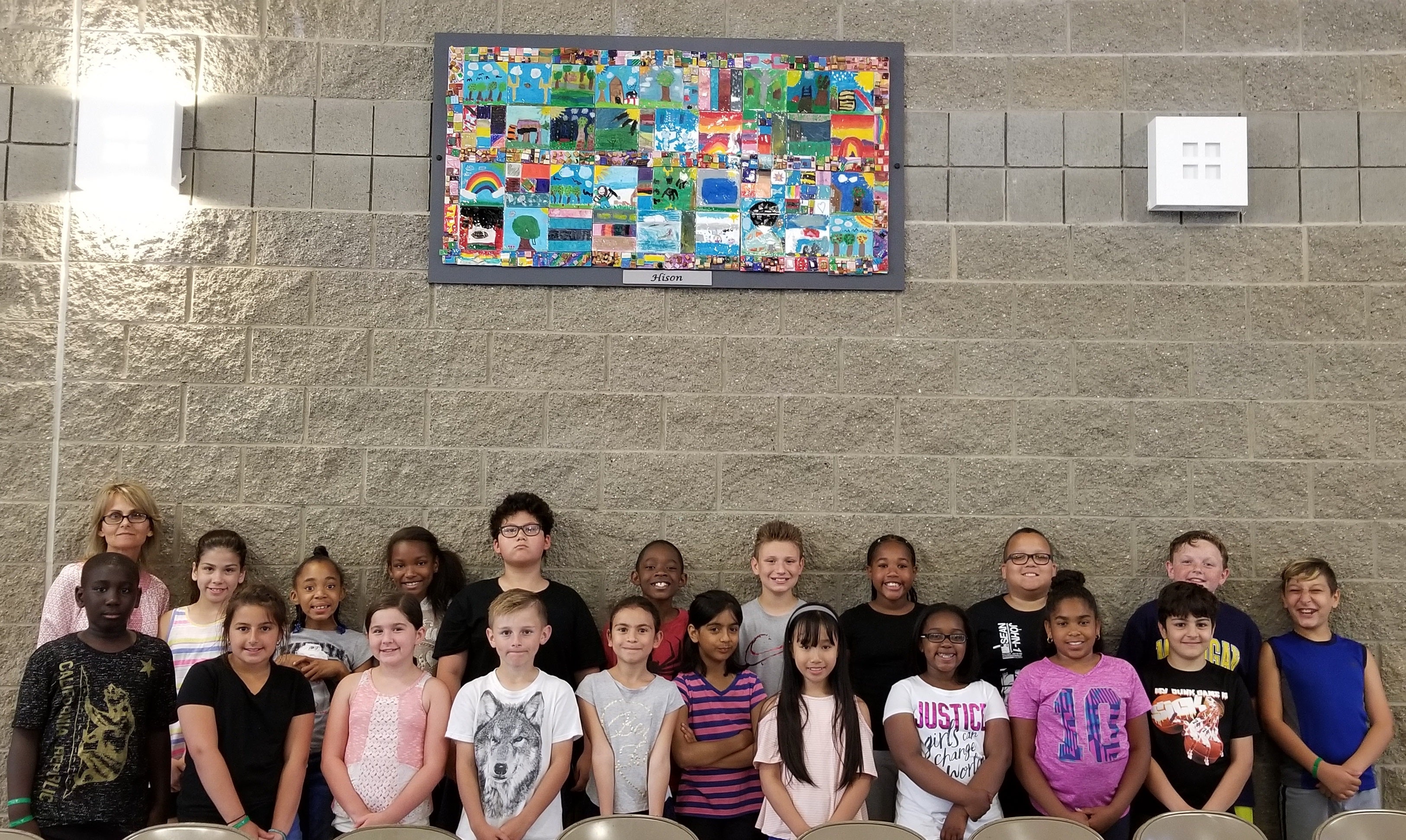 Students in front of their artwork