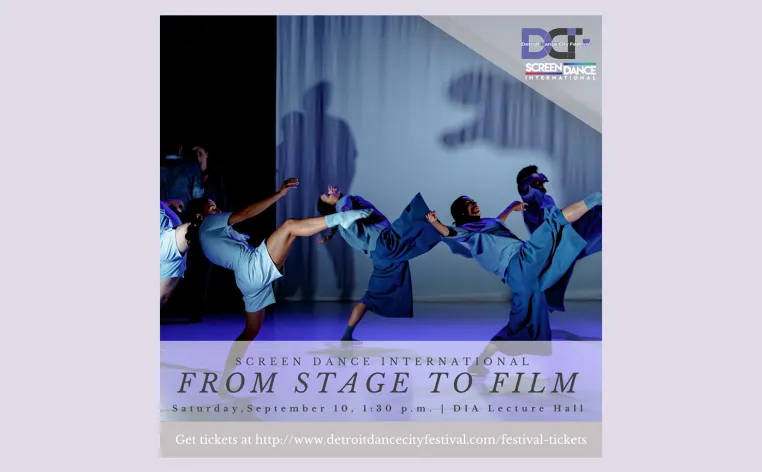 Dancers in blue lean back in unison on stage