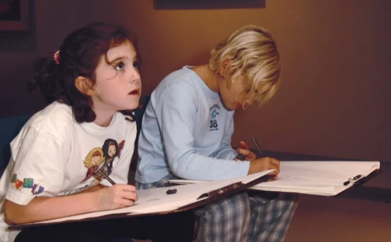 Two children drawing