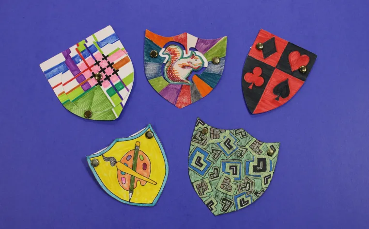 Examples of miniature coat-of-arms made in the DIA's Artmaking Studio