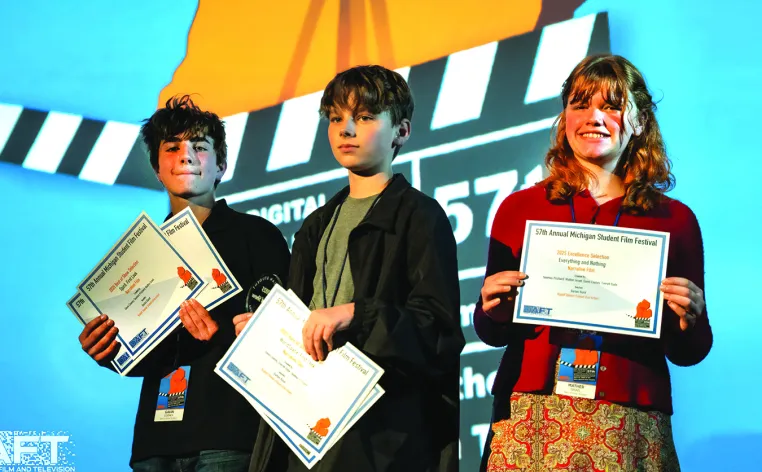 Students receiving awards on stage at a former Michigan Student Film Festival