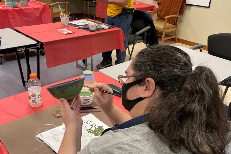 Two artists making bowls