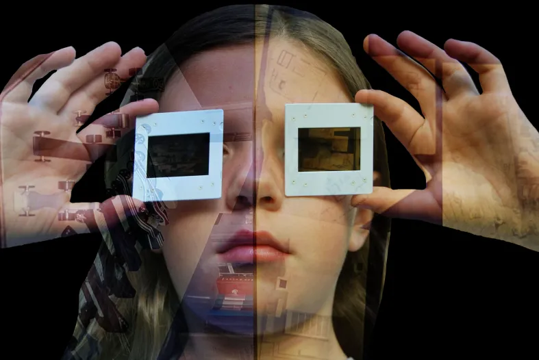 An image of a child holding cut-out squares over their eyes like 3D glasses