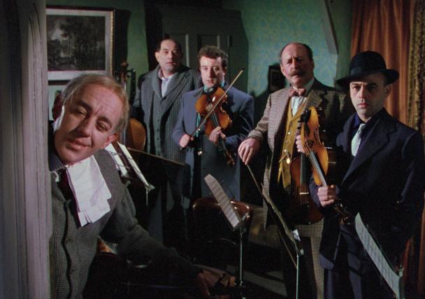 Four men in a string ensemble