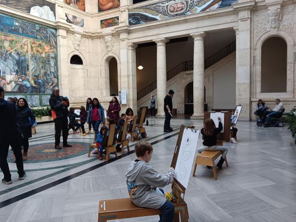 Visitors drawing in Rivera Court