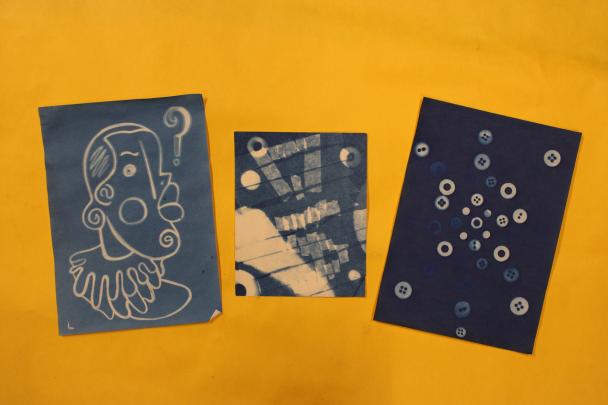 Three Sun Prints,  each eith different white imagery on a blue background