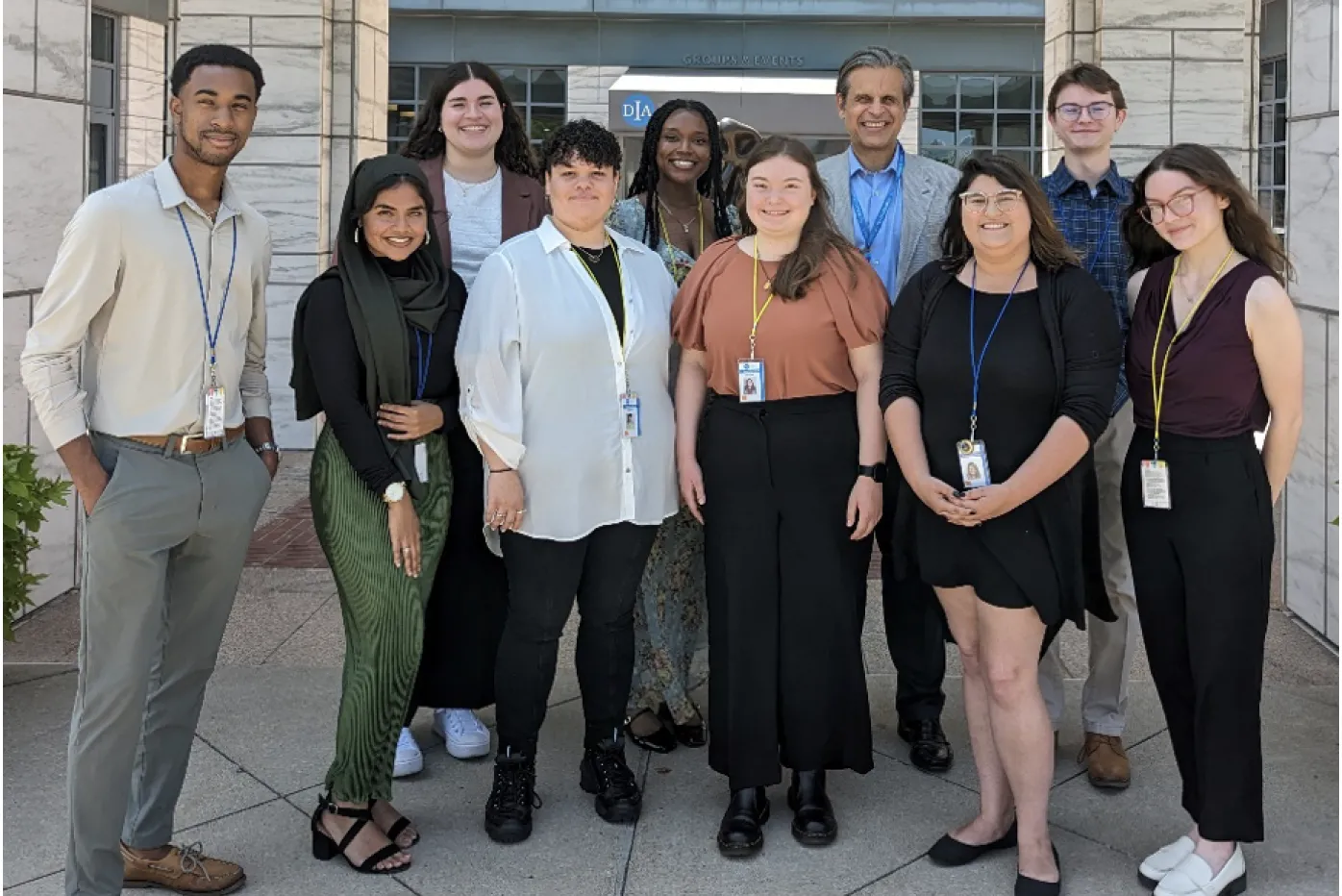 Director standing with Interns