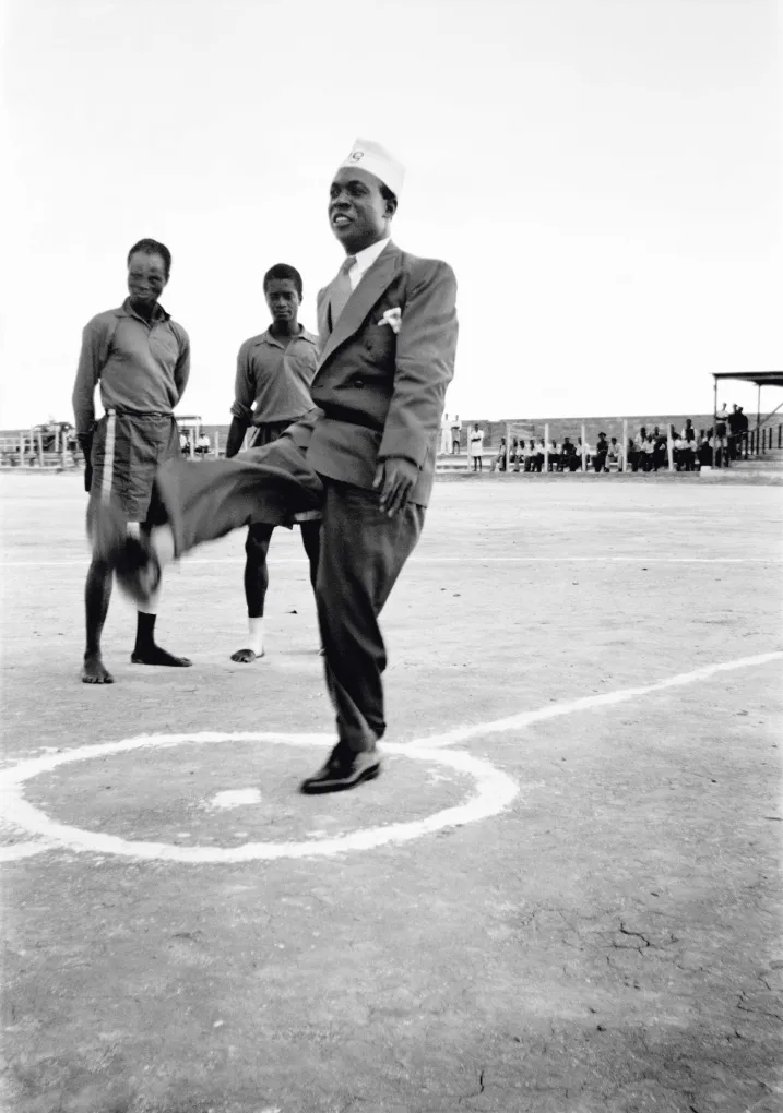James Barnor (Ghana, b. 1929). Kwame Nkrumah in his prison graduate cap, kicking a soccer ball before the start of an international match at Owusu Memorial Park, Fadama neighborhood, Accra, 1952 (printed 2010–20). Gelatin silver print. Autograph, London.