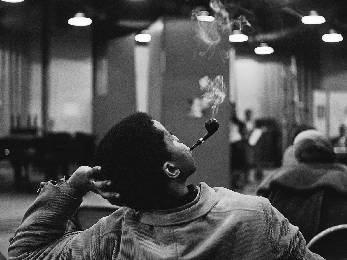 Man smoking in a ballroom, Harlem, ca. 1962; from Kwame Brathwaite: Black Is Beautiful (Aperture, 2019)
