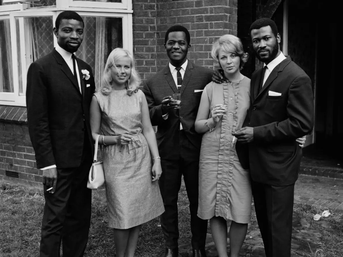 James Barnor (Ghana, b. 1929). A group of friends after the wedding of Mr. and Mrs. Sackey, Balham, London, 1966 (printed 2010–20). Gelatin silver print. Galerie Clémentine de la Féronnière, Paris. © James Barnor, courtesy Galerie Clémentine de la Féronnière, Paris.