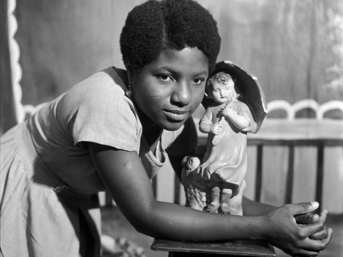 James Barnor (Ghana, b. 1929). Beatrice Okaijah with trademark figurine, Ever Young Studio, Accra, c. 1953 (printed 2010-20). Gelatin silver print. Autograph, London.