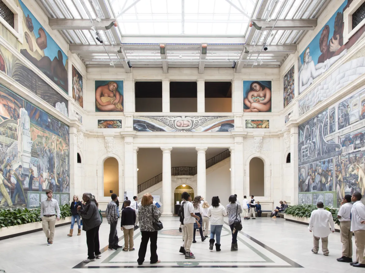 People in Rivera Court at the Detroit Institute of Arts