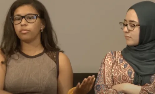 Still of two young women speaking as a part of Courageous Conversations
