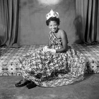 James Barnor (Ghana, b. 1929). Naa Jacobson as Ballroom Queen after a fashion show, Ever Young Studio, Jamestown, Accra, c. 1955 (printed 2010–20). Gelatin silver print. Autograph, London.