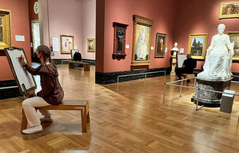 Masked patrons drawing in the American galleries