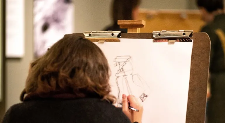 Person sketching on a canvas
