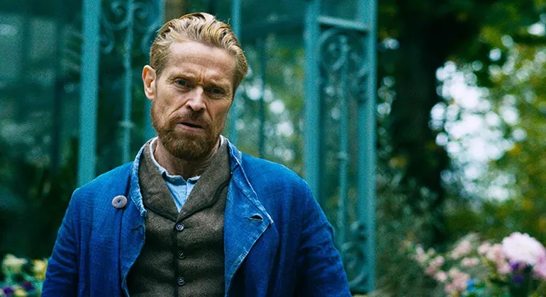 Willem Defoe portraying Van Gogh, standing in a garden