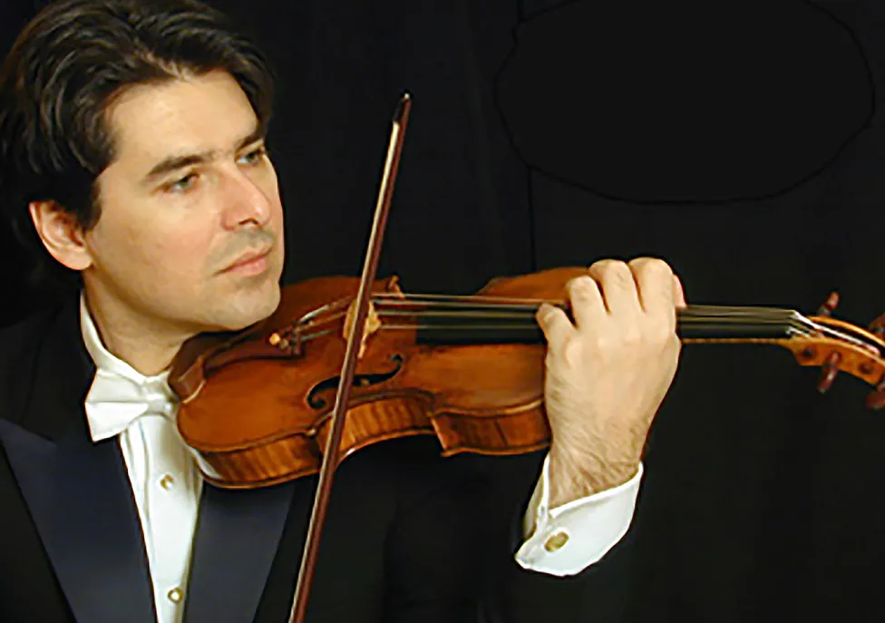 Eric Grossman pictured playing the violin in a tuxedo