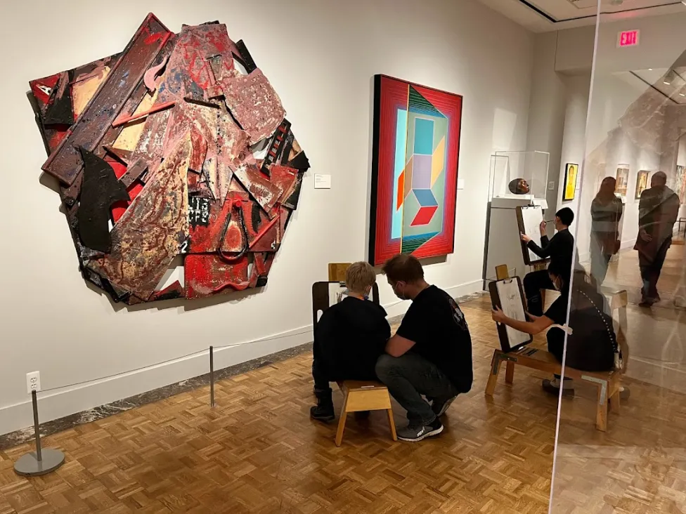 Visitors drawing in the African American galleries