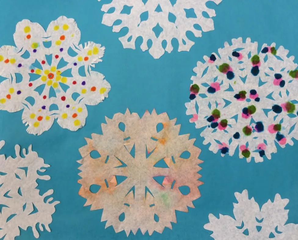 Examples of paper snowflakes made in the DIA's art-making studio