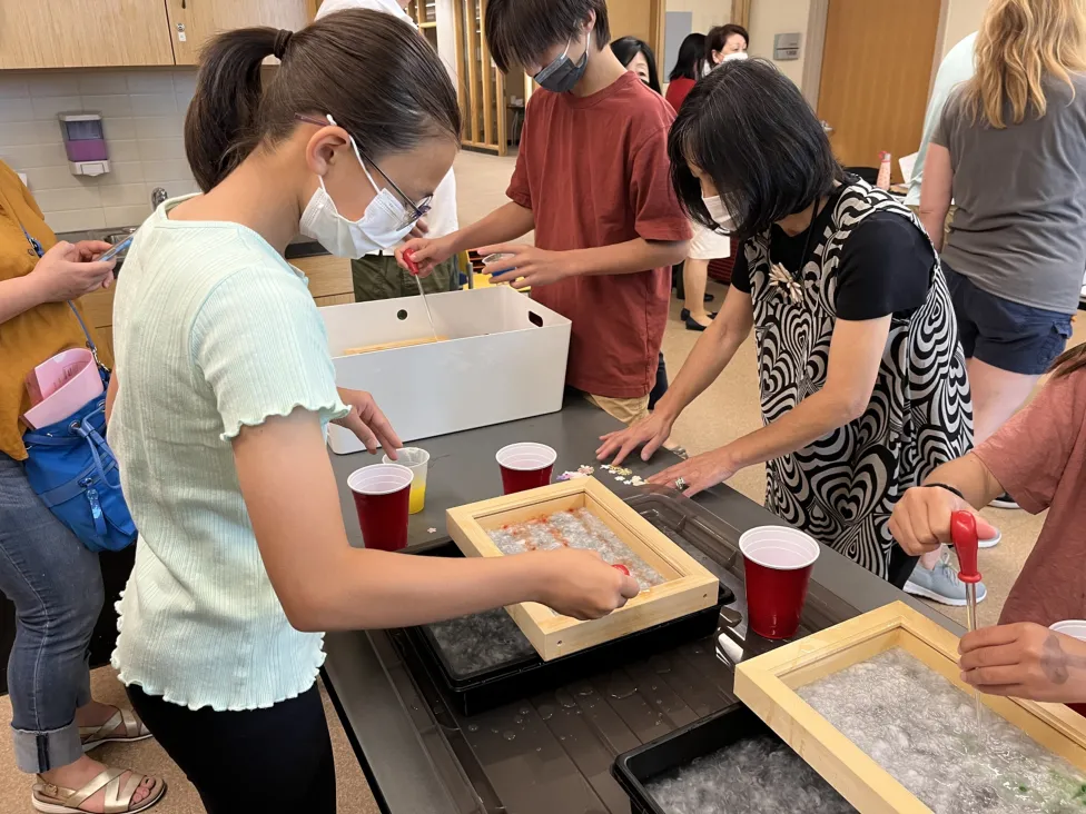 Visitors to the DIA Art-Making studio making washi