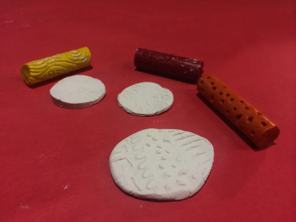 Examples of cylinder seals made at the DIA's Art-Making studio.