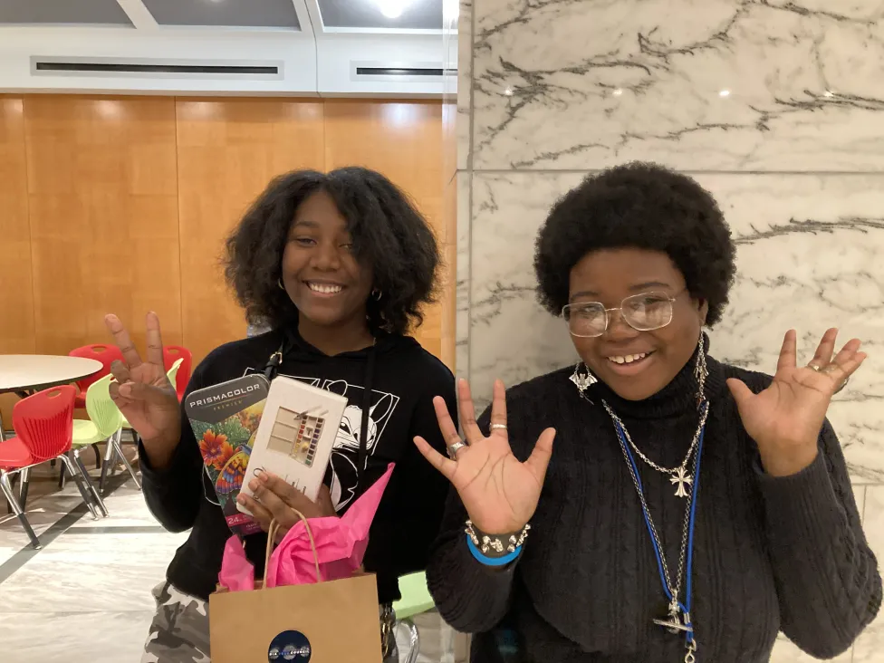 Teens pose with bullet journaling supplies in the DIA's Dining Rooms A and B