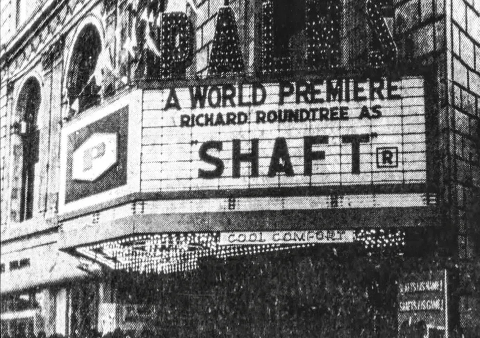 A theatre marquee with the words "A World Premiere, Richard Roundtree As Shaft."