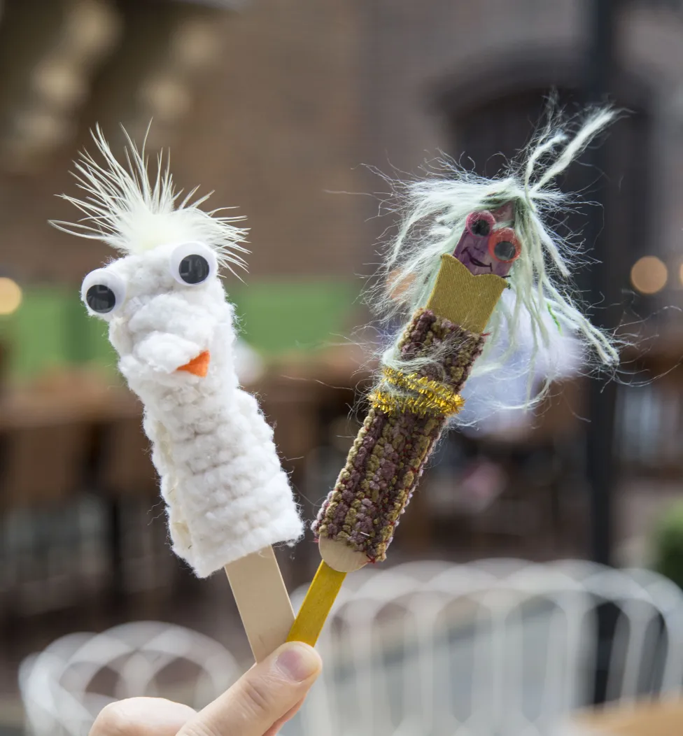 Examples of tongue depressor puppets made in the DIA Art-Making Studio