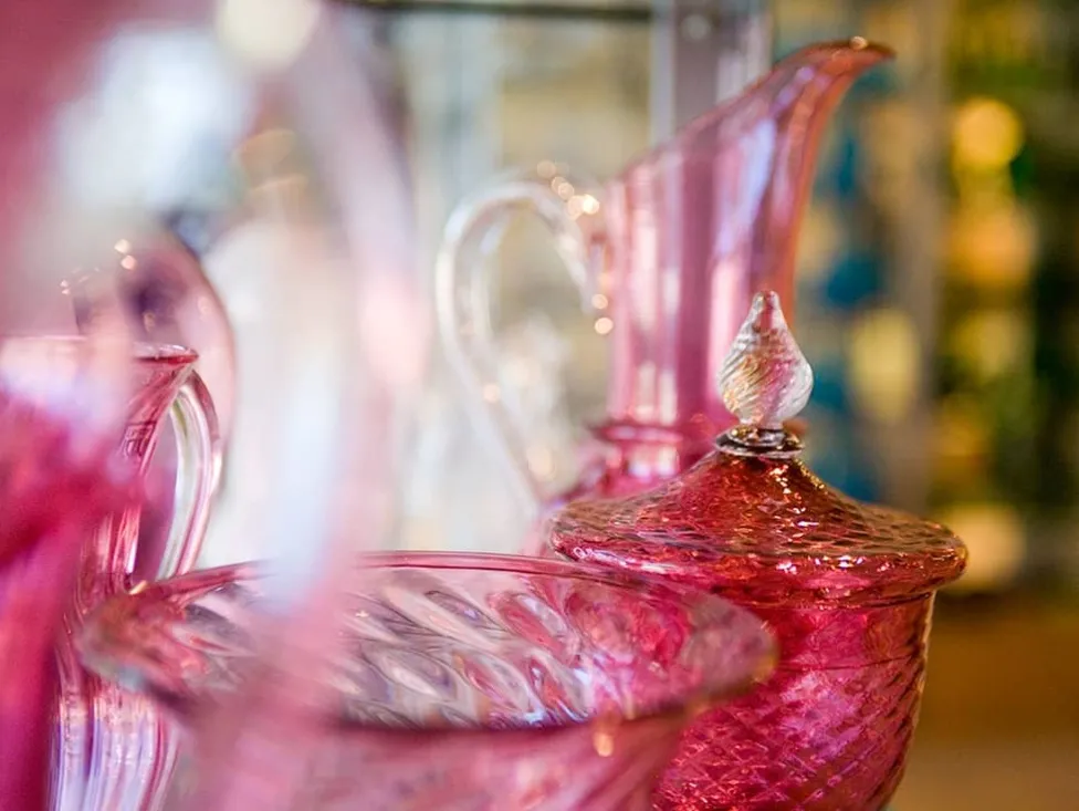 Pink blown glass items on display at Henry Ford's Greenfield Village