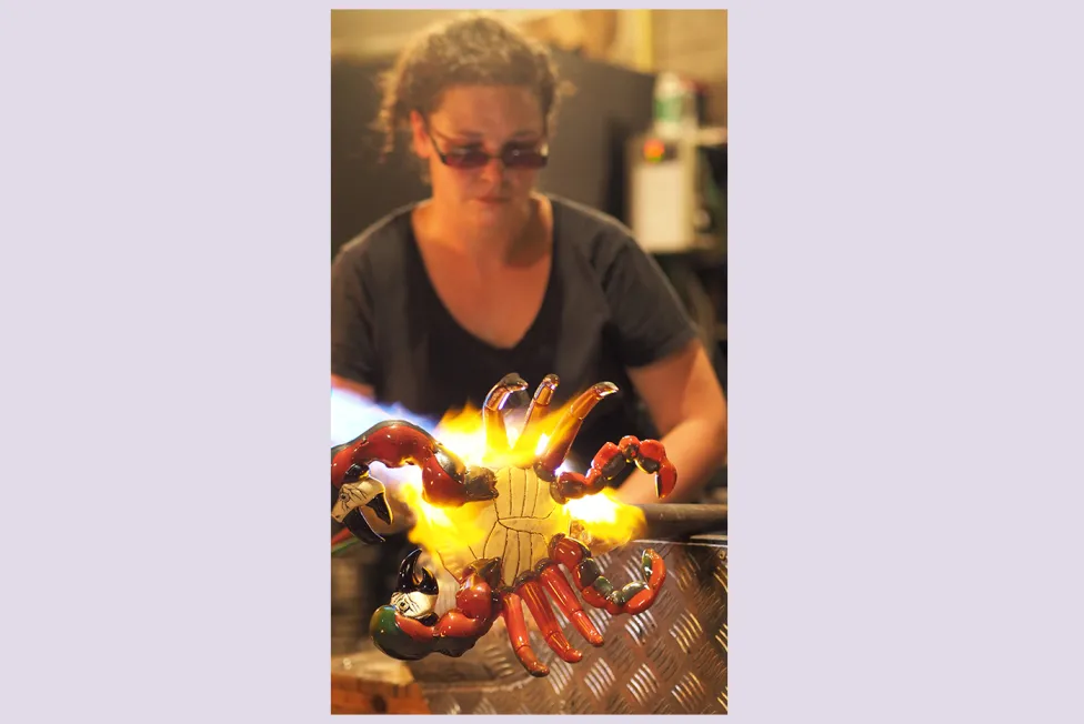 Charlyn Reynolds pictured glass blowing in sunglasses