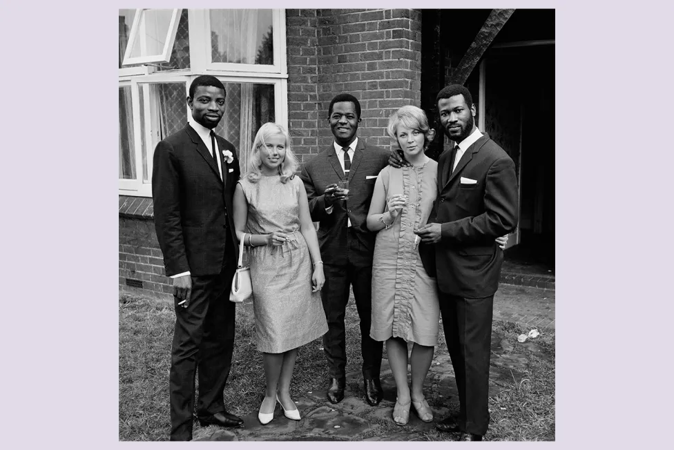 James Barnor (Ghana, b. 1929). A group of friends after the wedding of Mr. and Mrs. Sackey, Balham, London, 1966 (printed 2010–20). Gelatin silver print. Galerie Clémentine de la Féronnière, Paris.  © James Barnor, courtesy Galerie Clémentine de la Féronnière, Paris.