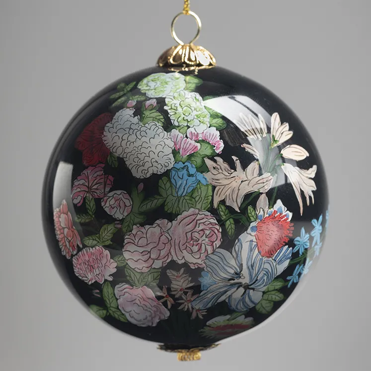 A beautiful hand-painted floral on black ornament.