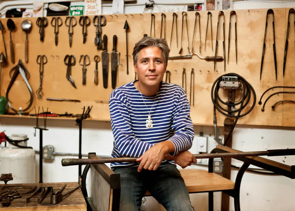 Renowned glass artist Preston Singletary posing with tools