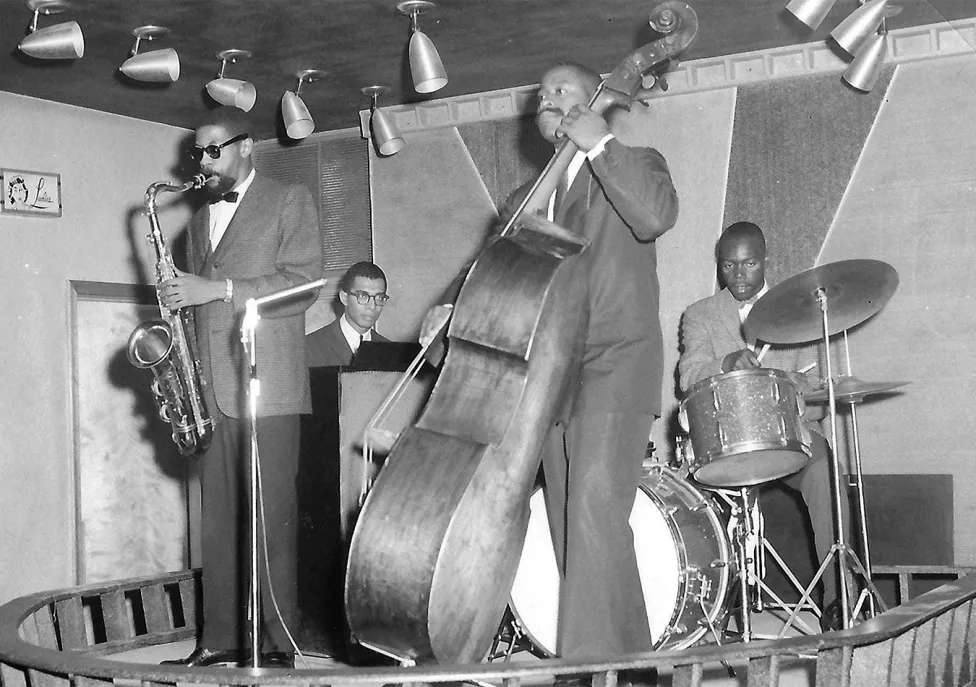 Jazz musicians playing on a small stage