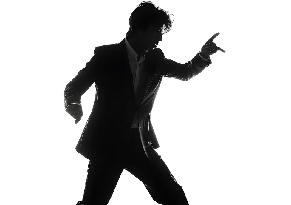 A person in a suit dances