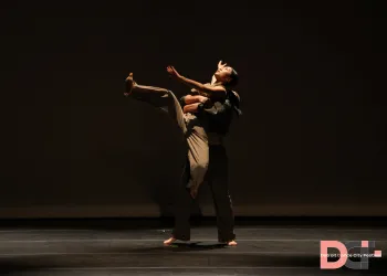 two dancers in sync on stage