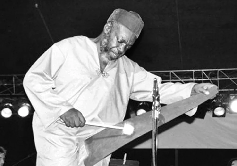 Roy Brooks performing on stage in black and white