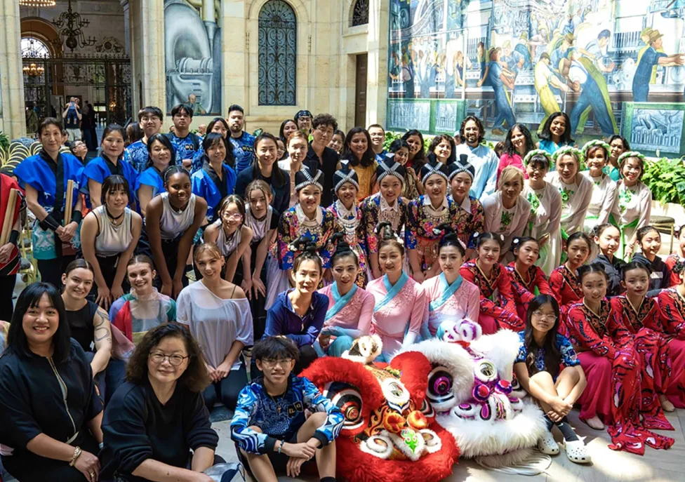 AAPI Performers pose for a photo in the DIA's Rivera Court