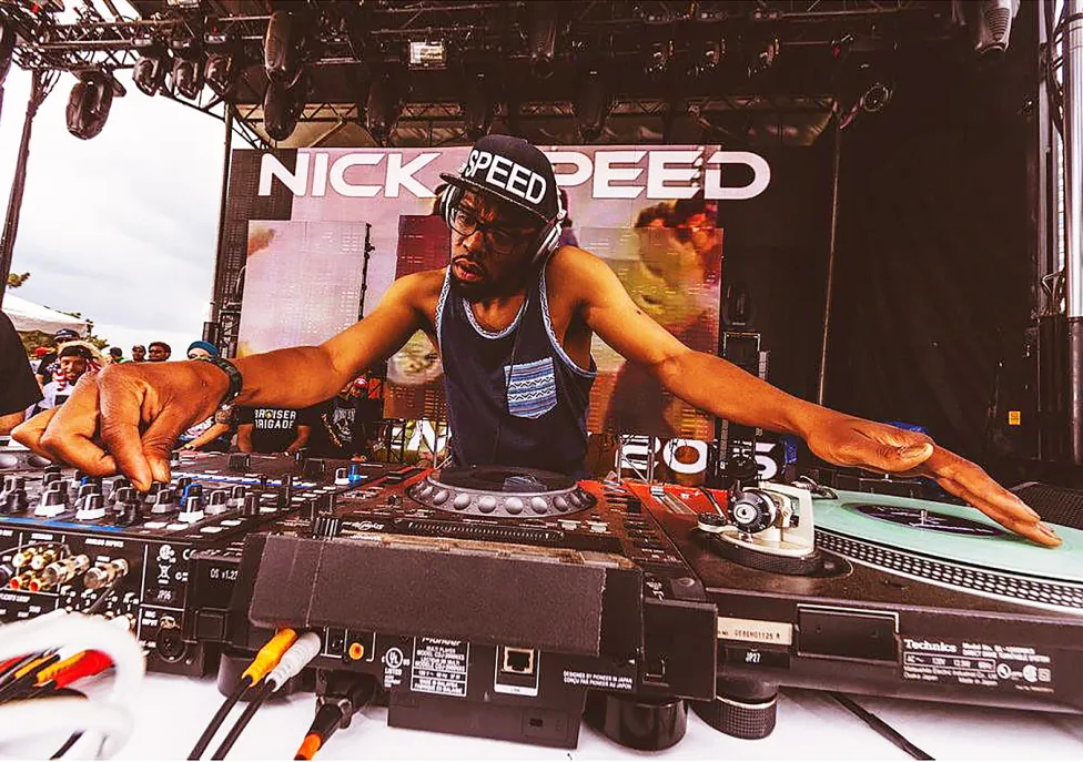 Nick Speed at a DJ table