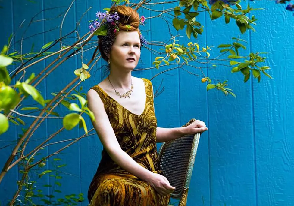 Sarah Cahill poses on a chair