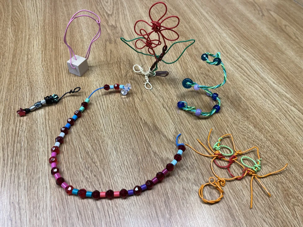 Examples of wearable wire sculptures made in the DIA's Artmaking studio