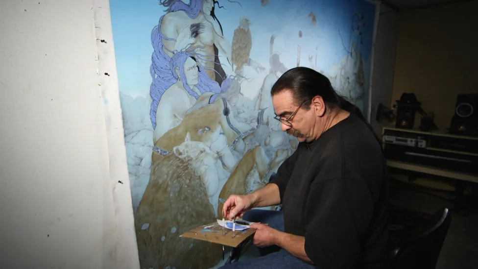 A man painting a mural