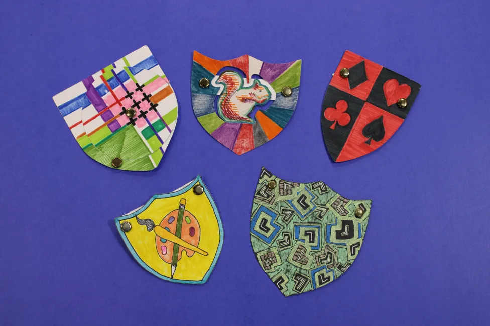 Examples of miniature coat-of-arms made in the DIA's Artmaking Studio