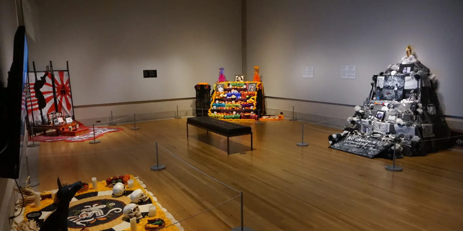 One room of the 2022 Ofrendas exhibition, featuring five Ofrendas altars
