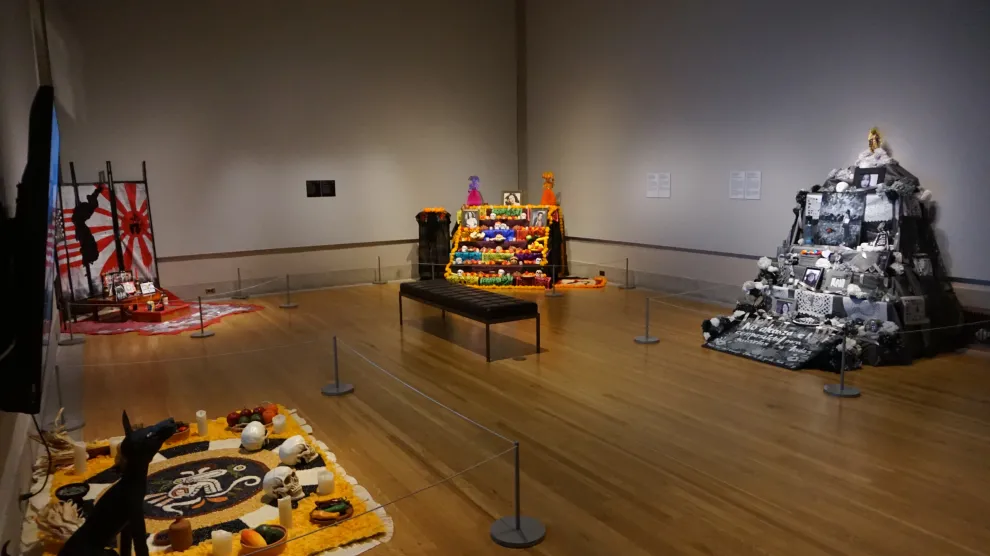 One room of the 2022 Ofrendas exhibition, featuring five Ofrendas altars
