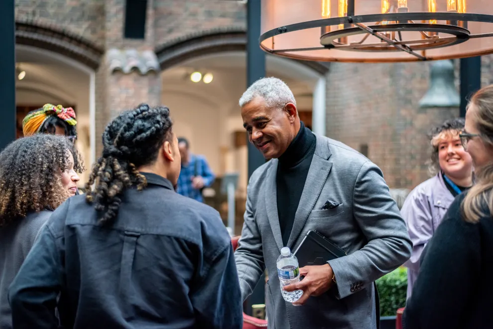 Board Chairman Lane Coleman chats with staff during a party in Kresge Court at the Detroit Institute of Arts..